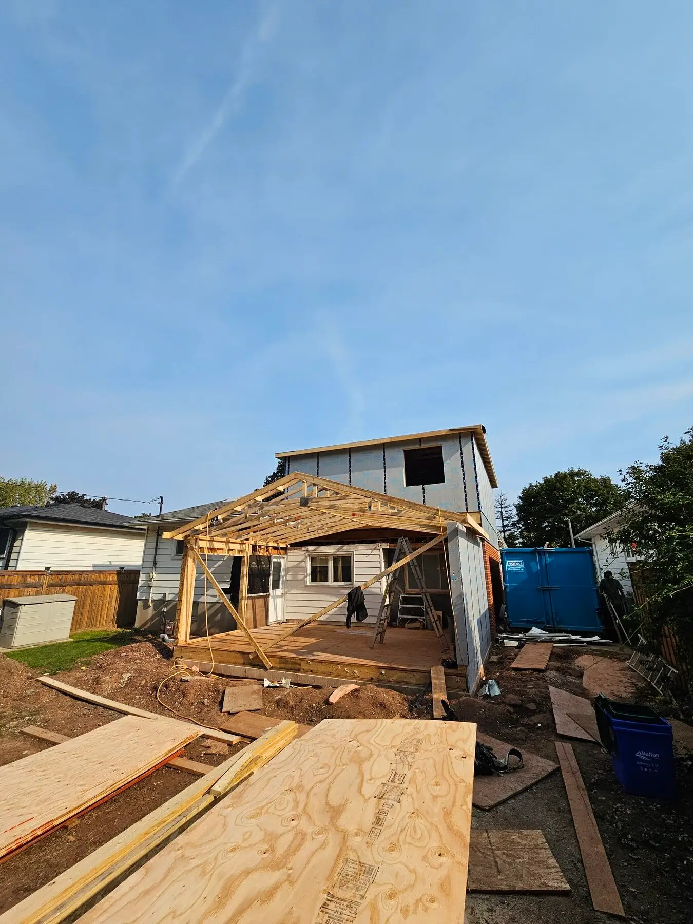 Second-storey addition framed above the existing Burlington bungalow