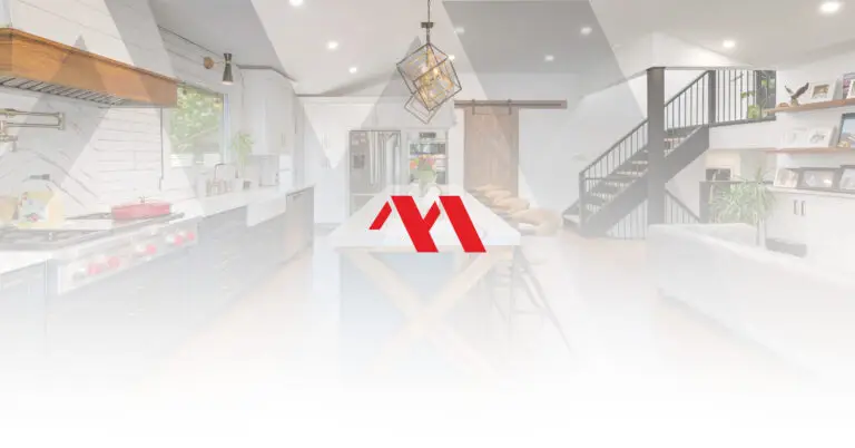 Open concept kitchen, dining and living space with a barn door and open staircase, with the Marcon Construction mark overlaid