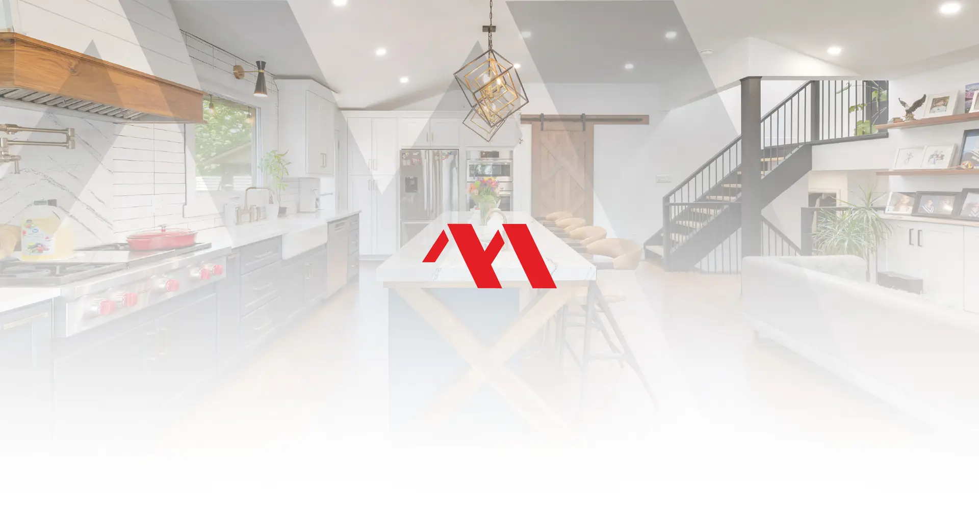 Open concept kitchen, dining and living space with a barn door and open staircase, with the Marcon Construction mark overlaid