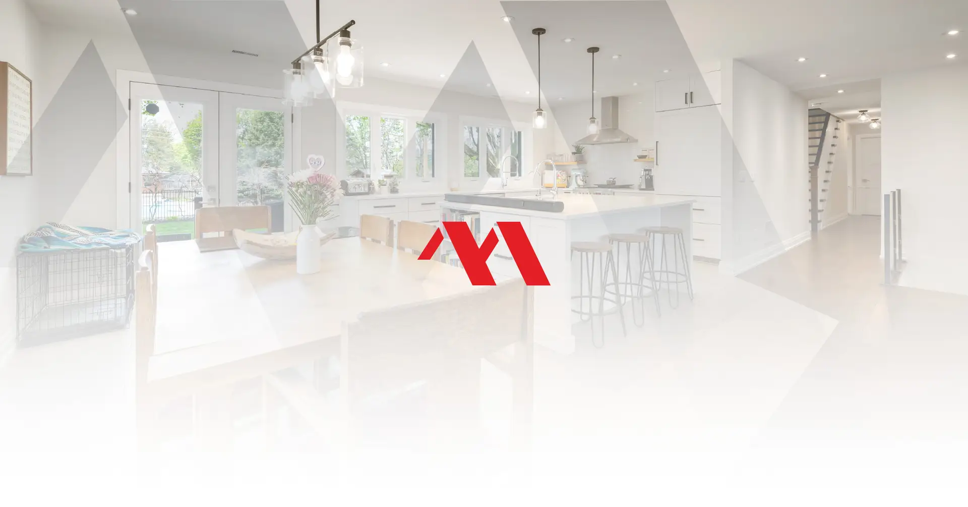 Bright renovated open kitchen and dining area in a lived-in Burlington home, with the Marcon Construction mark overlaid
